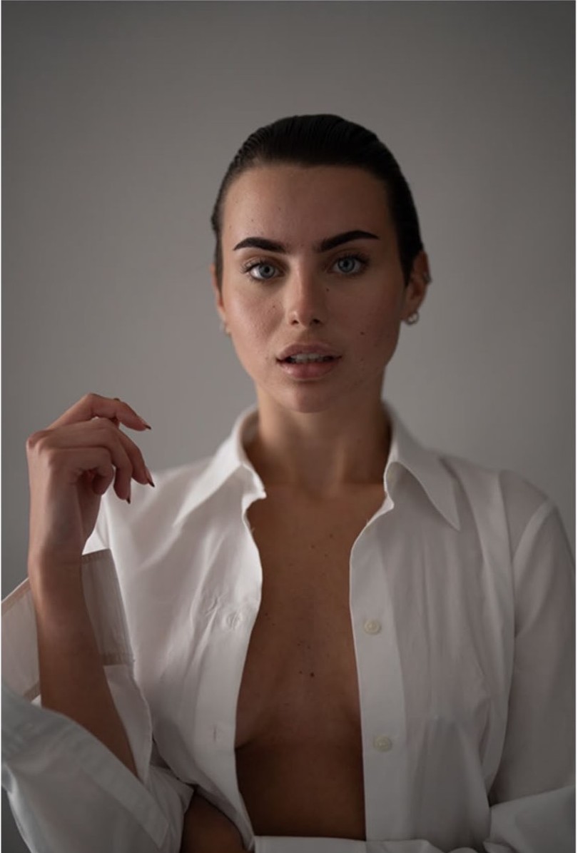Studio beauty portrait in an open white shirt