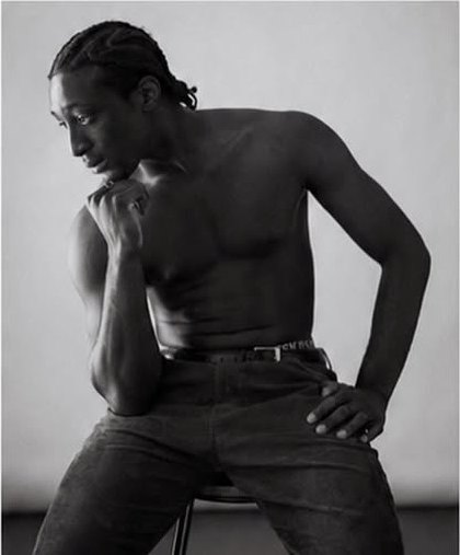 Brian N seated editorial portrait showing physique