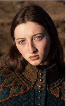 Veronika K close editorial portrait in patterned knitwear