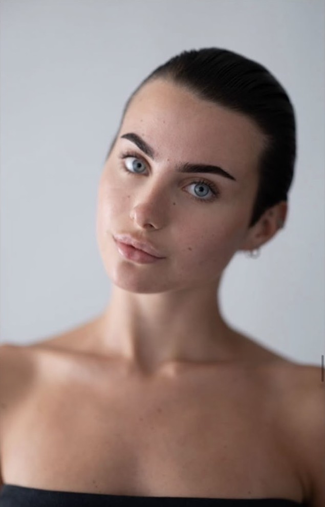 Clean beauty headshot with slicked-back hair